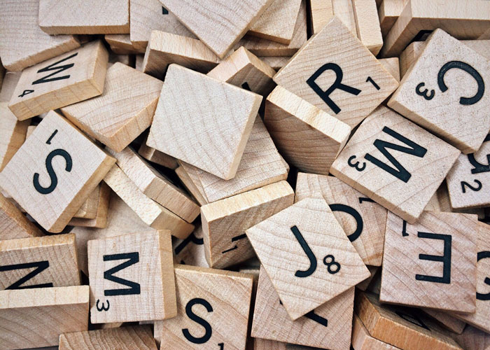 small wooden squares with letters and numerals on them