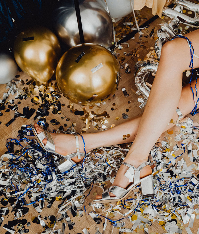 woman's legs on the background of confetti