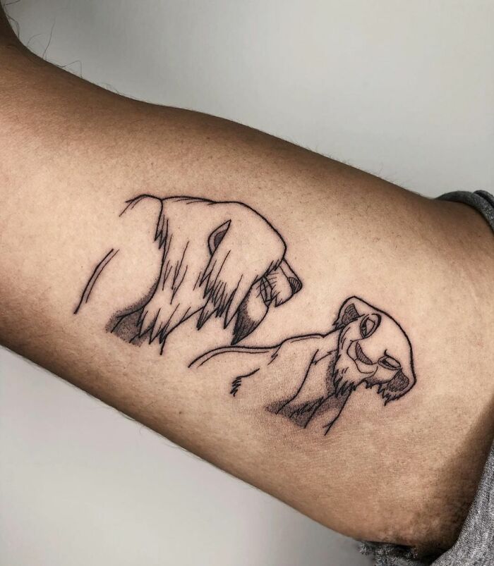 Simba and Nala from The Lion King arm tattoo