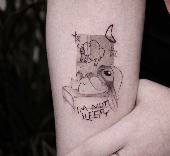 Stitch having insomnia arm tattoo 