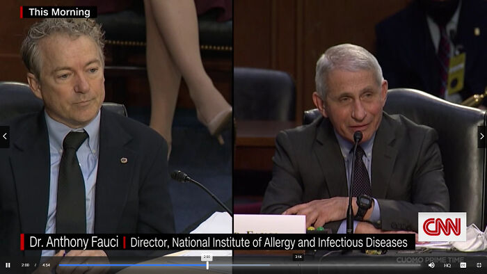 On The Right Rand Paul The Senator Of Kentucky Trying To Argue To Anthony Fauci Who Serves As The Director Of The U.S. National Institute Of Allergy And Infectious Diseases And The Chief Medical Advisor To The President That Mask Aren't Required With A Vaccine