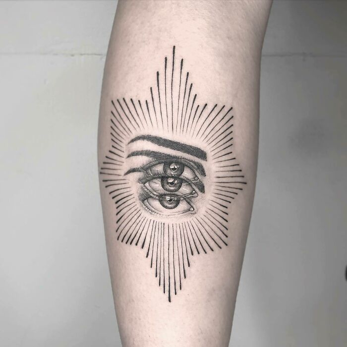 Trippy blurred eyes with eyebrows arm tattoo
