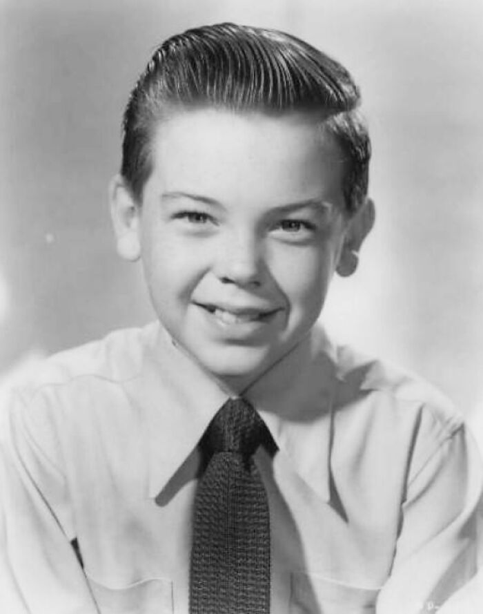 Black and white picture of Bobby Driscoll smiling