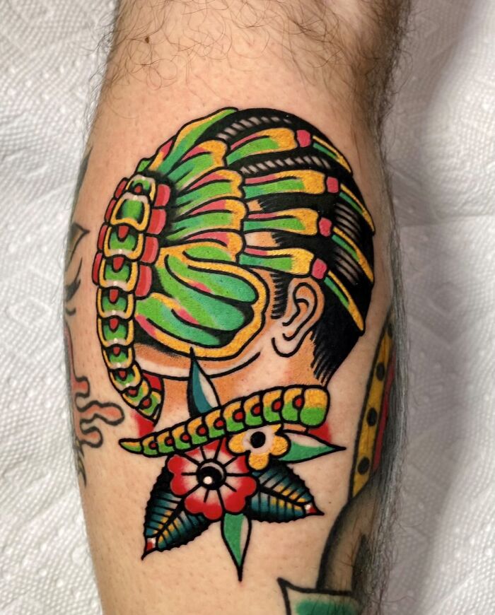 Colorful facehugger leg tattoo