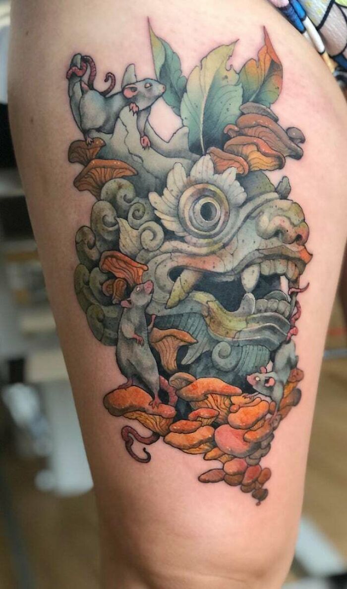 Trippy ancient colorful dragon with mouse leg tattoo