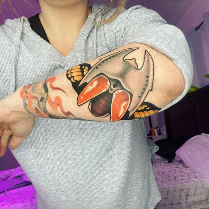Flying animal arm tattoo