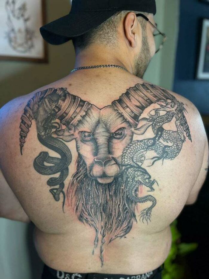 Capricorn sea-goat back tattoo