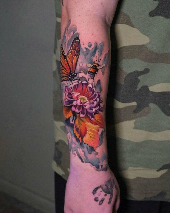 Flowers with bee and butterfly arm tattoo