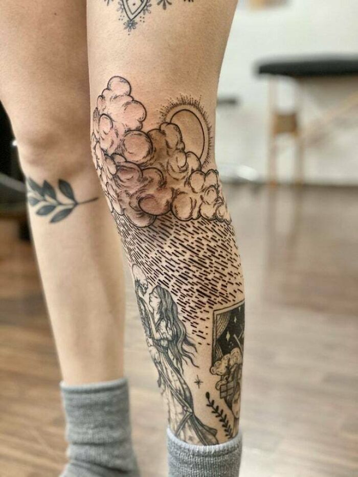 Clouds with summer and rain knee tattoo