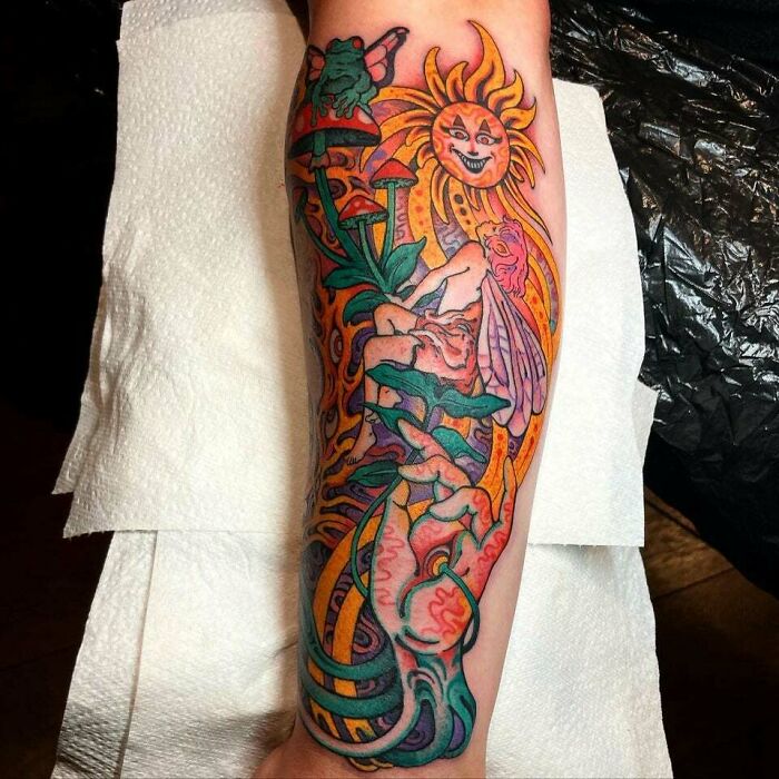 Colorful fairy with mushrooms sun and frogs arm sleeve tattoo