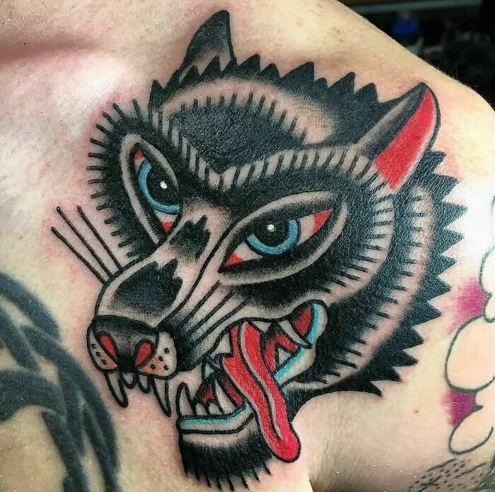 Colorful wolf chest tattoo