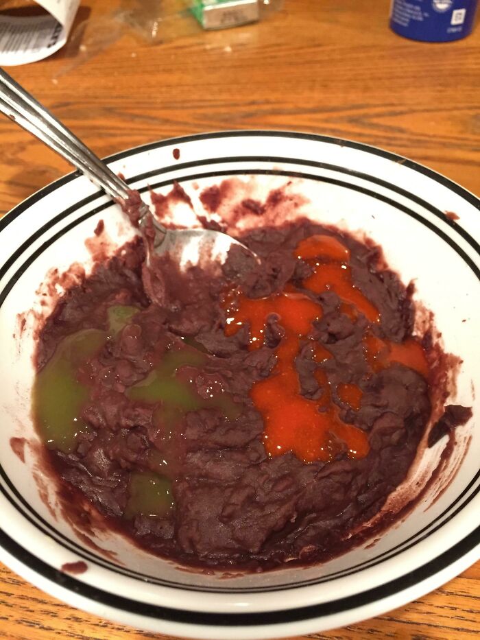 Refried Black Beans With A Green Sauce And Red Sauce. I Call It Black Christmas