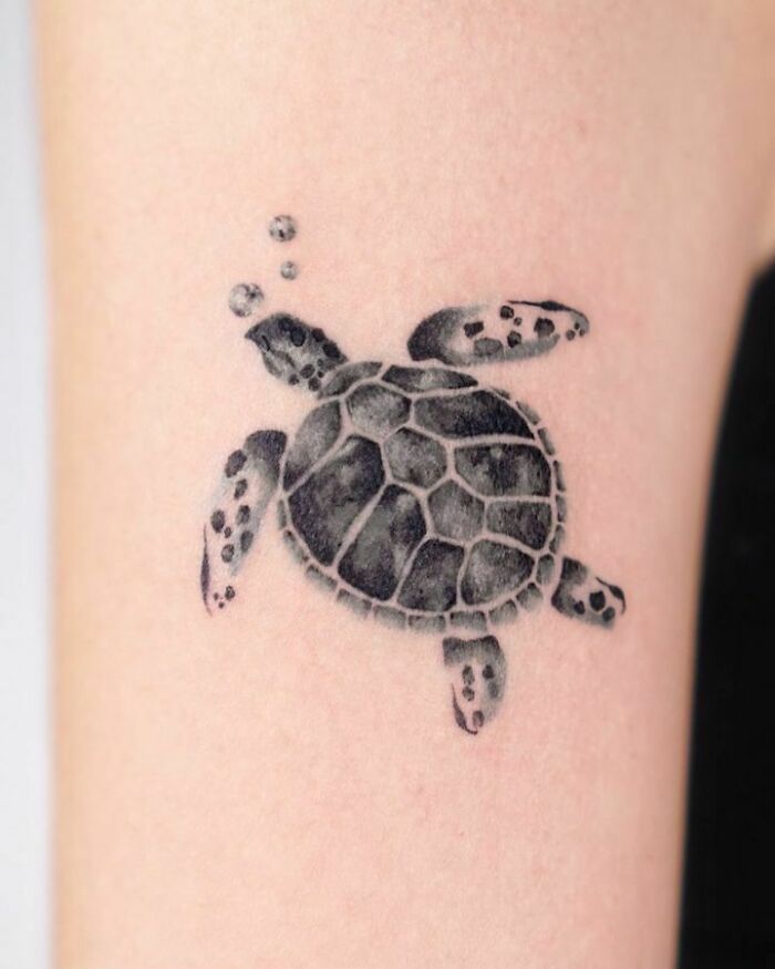 Turtle swimming tattoo 