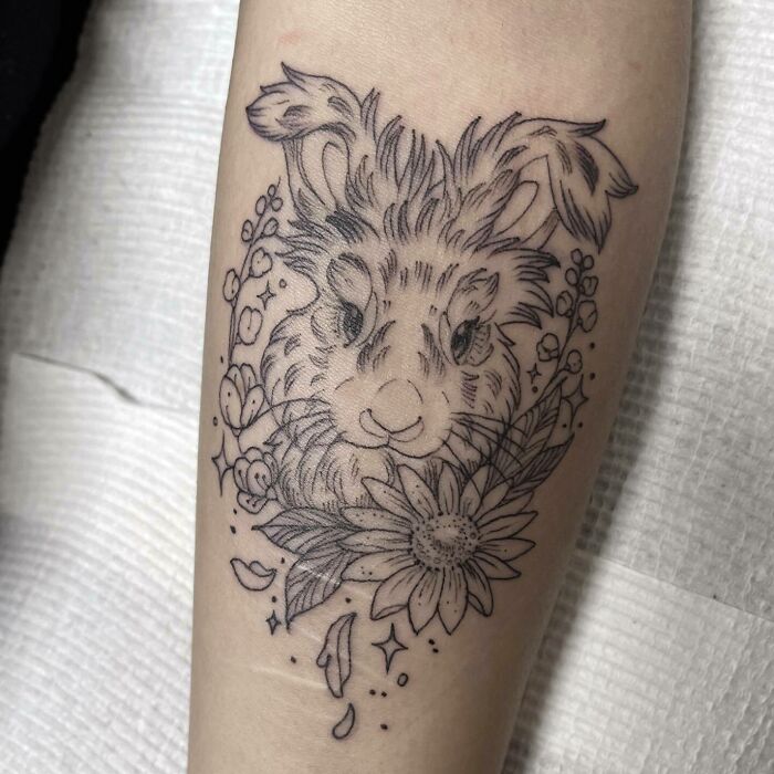 Rabbit with flowers tattoo
