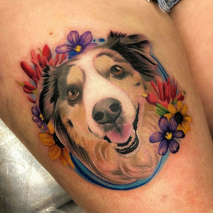 Dog's face with flowers tattoo 