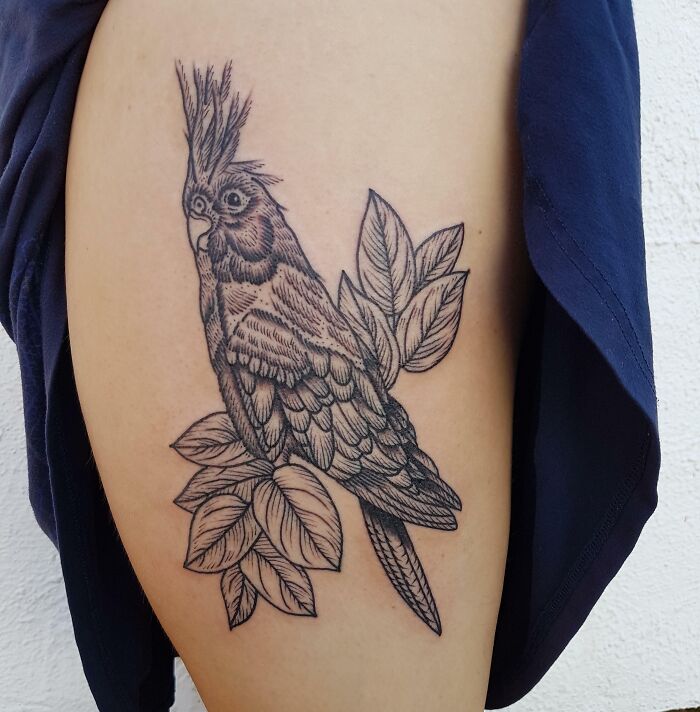 Parrot with leaves tattoo