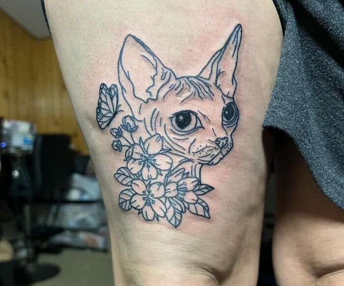 Cat with flowers tattoo