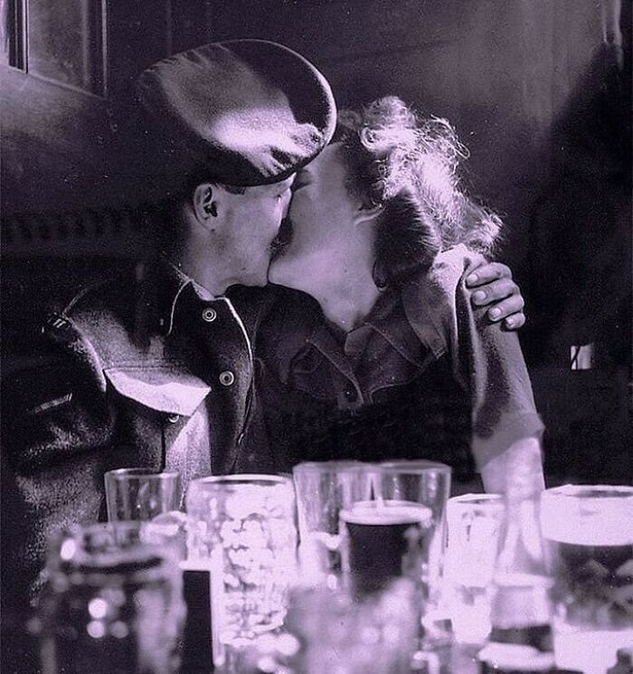 A Couple Kissing In A Pub As They Celebrate The End Of World War II, London, 1945