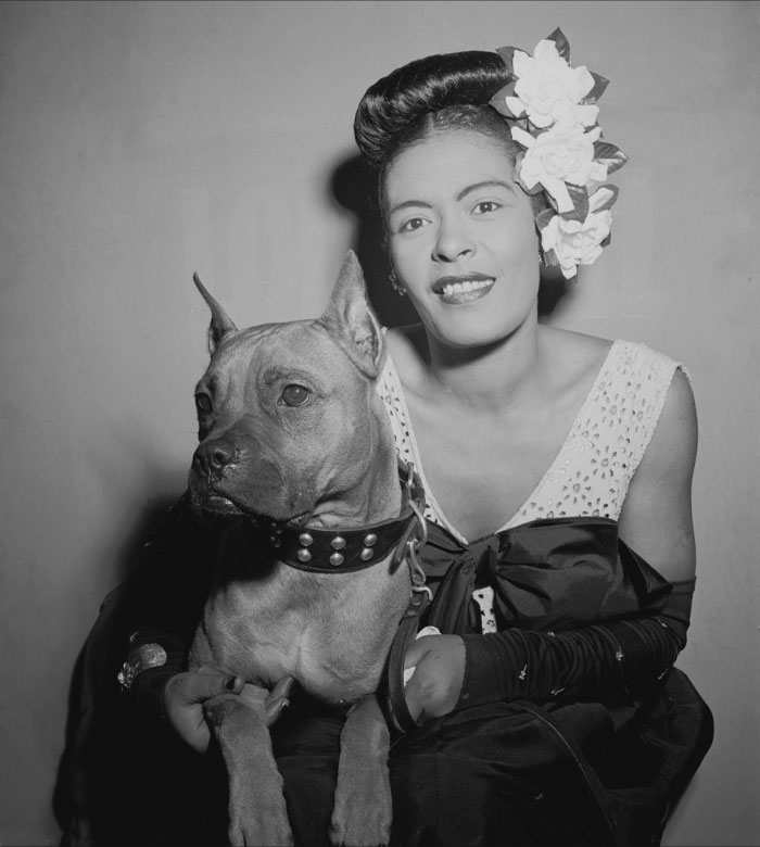 Black and white picture of Billie Holiday with her dog