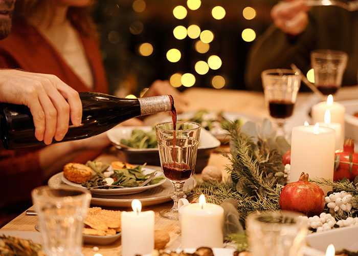 Woman Brings 5 Bottles Of Wine To Sister-In-Law's Christmas Dinner, Is Charged Additional $50 For Food