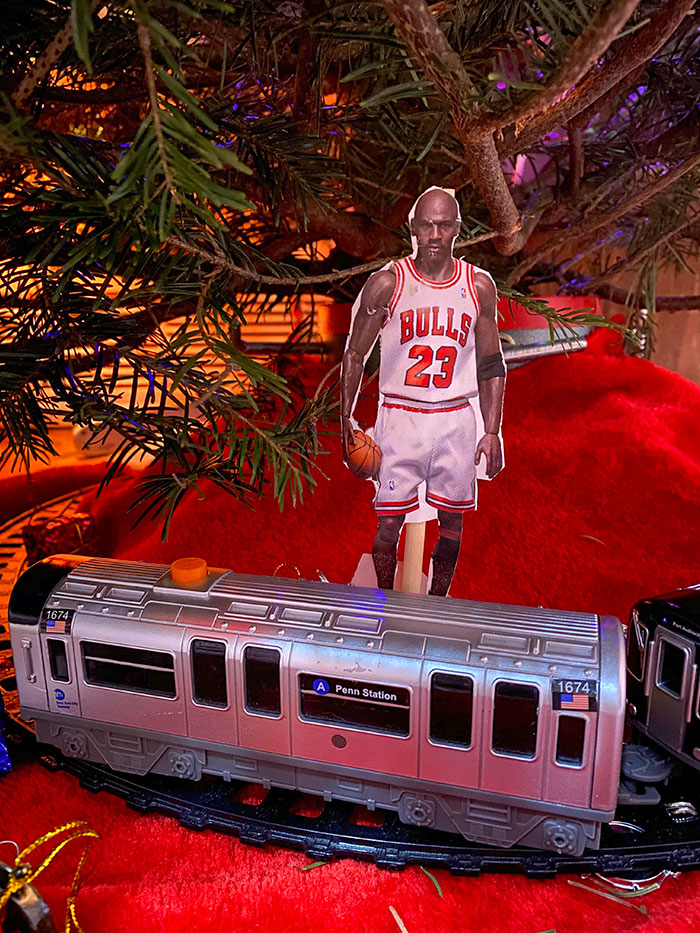 We Have A Tiny Michael Jordan Attached To Our Electric Train Underneath The Christmas Tree A La Home Alone