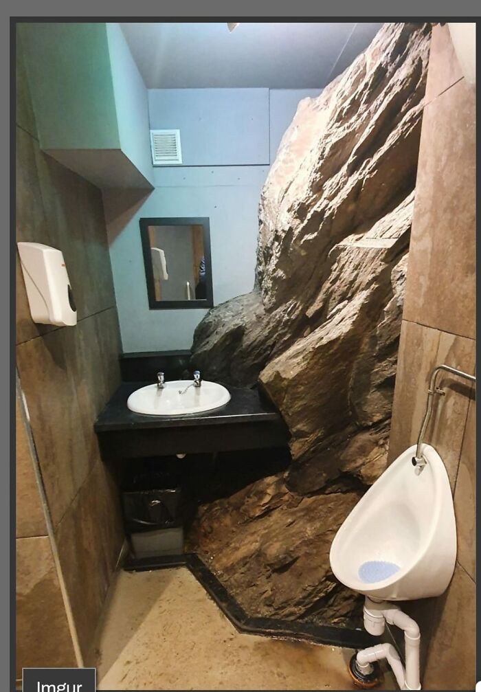 This Pub Bathroom That Was Built Around The Cliff Instead Of Through It, Giant Natural Rock Wall Right Next To A Urinal