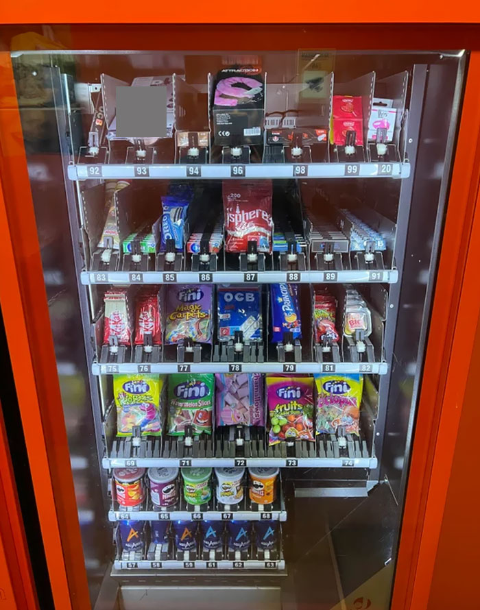 Just A Vending Machine That Sells Soft Drinks (Bottom), Snacks (Middle) But Also Adult Toys (Top). Found In Spain