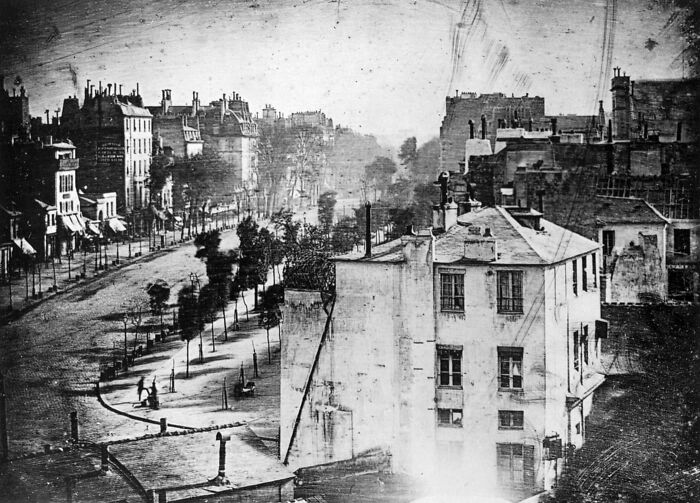 The First Photo Of A Person. Taken In 1838 By Louis Daguerre, This Is Believed To Be The Earliest Photograph Showing A Person. The Photo Was Taken Of Boulevard Du Temple, Paris