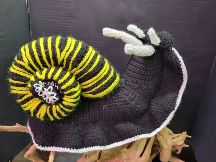 Giant Land Snail Made From A Crafty Intentions Pattern. White Yarn Is Glow In The Dark