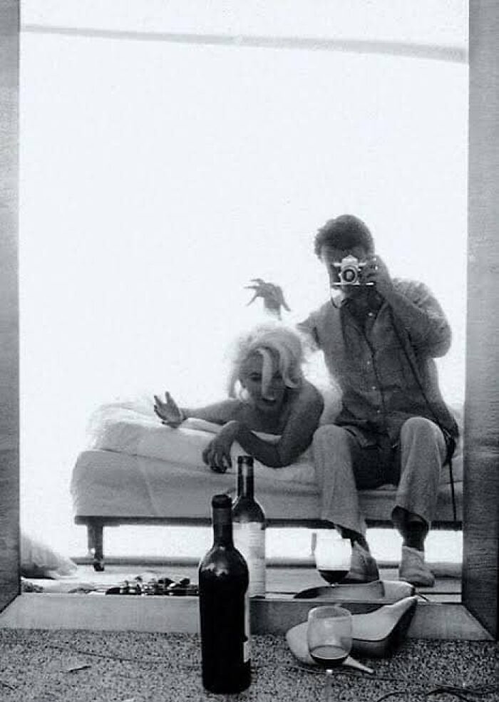 Photographer Bert Stern Taking A Mirror "Selfie" With Marilyn Monroe On A Bed During A Legendary Photo Shoot For Vogue In 1962