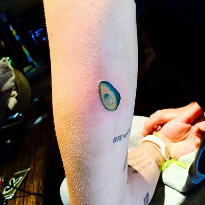 Avocado tattoo on a person's arm, symbolizing unique celebrity tattoos.