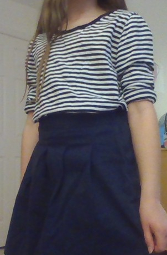 A Striped Shirt And Blue Skirt
