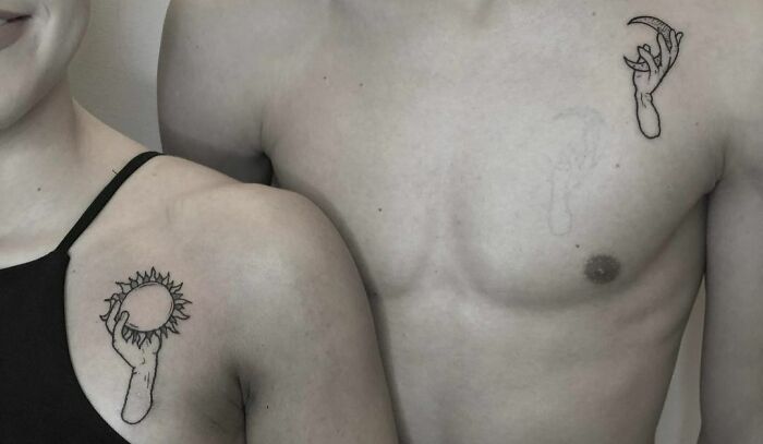 Sun and moon in hands matching shoulder tattoos