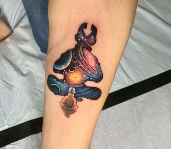 Colorful Avatar Aang arm tattoo