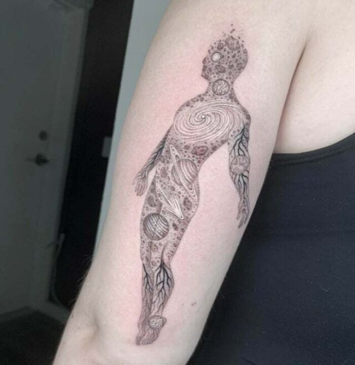 Space universe man arm tattoo