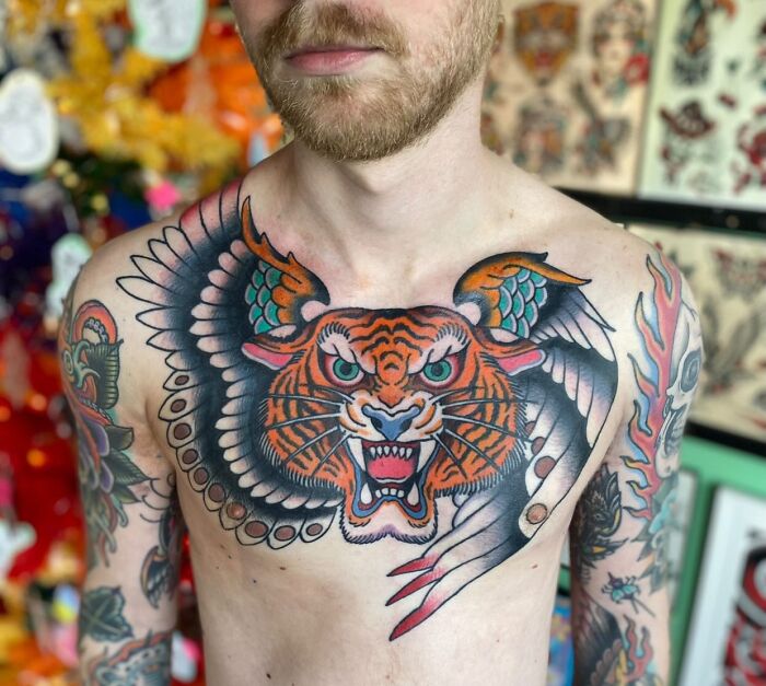 Flying tiger with wings chest tattoo