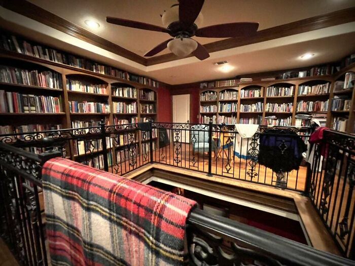 Brown bookshelf with books 