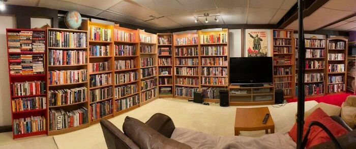A room field with brown with bookshelfs 