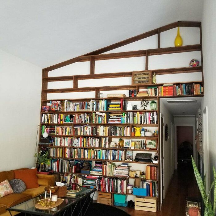 brown wooden bookshelf on the wall 
