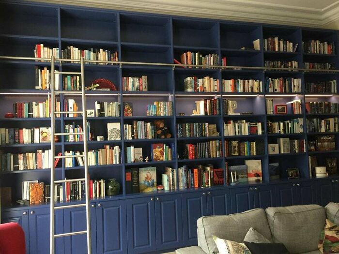 blue bookshelf with ladder 