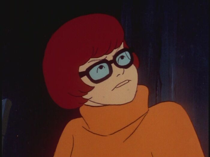 Velma Dinkley wearing orange sweater 