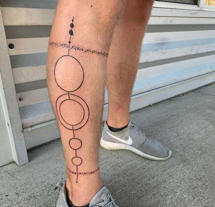 minimalistic tattoo of the solar system