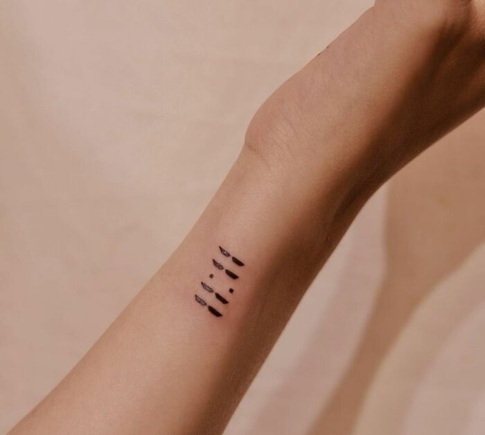 minimalistic tattoo of 11:11