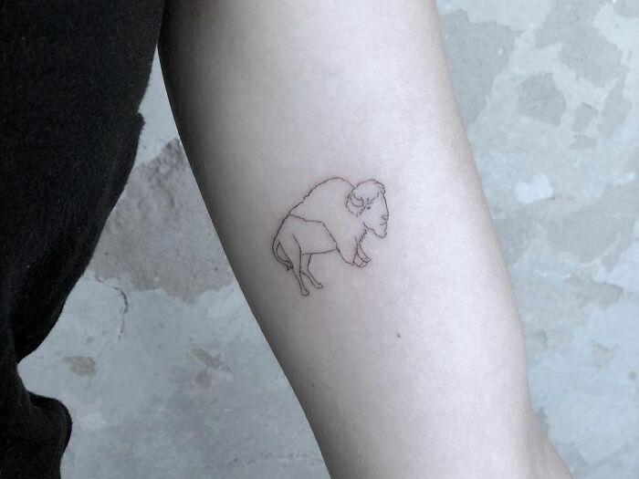minimalistic tattoo of a bison