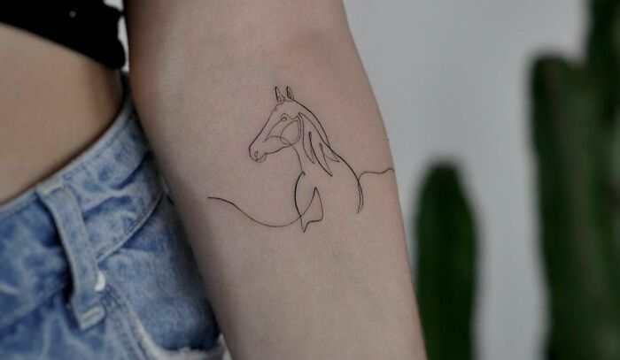 minimalistic tattoo of a horse
