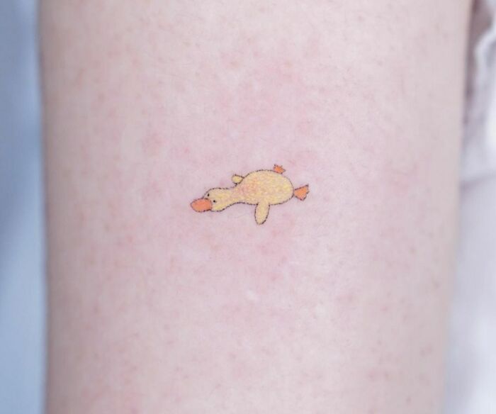 minimalistic tattoo of a duck