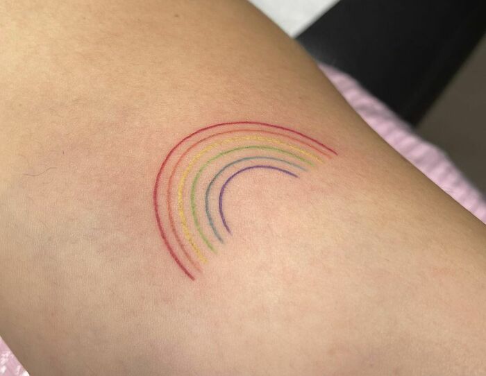 Minimalistic rainbow tattoo
