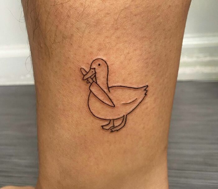 Minimalistic duck with a knife tattoo