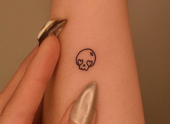 Minimalistic skull tattoo