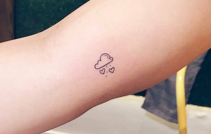 Minimalistic cloud tattoo